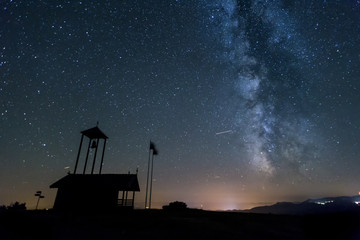 Fototapeta na wymiar Milky way galaxy over a Chapel in Bulgaria