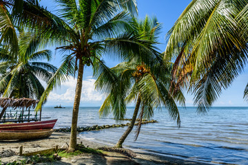 Fototapeta na wymiar Boats on Caribbean beach, Guatemala