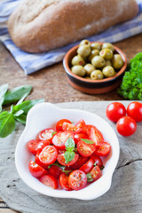Cherry tomatoes basil salad.
