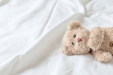 Fototapeta premium Teddy Bear lying in the bed / Teddy bear