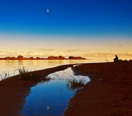 Night fishing man. Moon