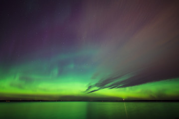 Northern lights over lake in finland