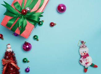 Christmas decoration  on color background . Red and gift box and decorate ball  .top  view composition.