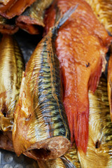 Set of smoked fish in a tin pan