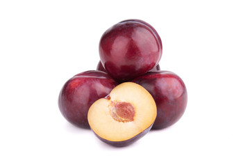 Plum fruits and a half  on white background
