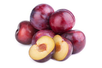 Group of plum fruits and a half  on white background