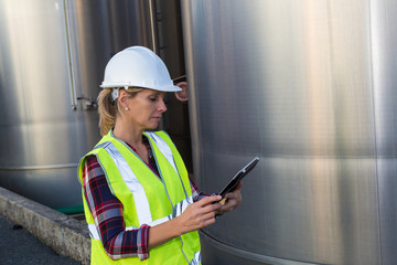 female engineer inspecting food industry installation - 126681227