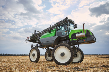 Obraz premium The tractor works in a field