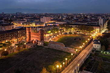 Fototapeta na wymiar Turin (Torino) night view on Porte Palatine and Porta Palazzo