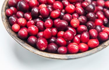 Fresh cranberries in wooden bowl