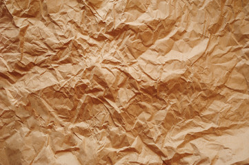 Fototapeta premium Brown texture of crumpled paper