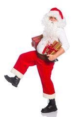 Portrait of happy Santa Claus holding Christmas gifts
