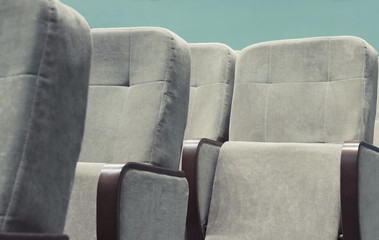 Obraz premium Empty auditorium with beige chairs, theatre or conference hall