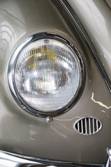 Close-up of front right side of a grey vintage car