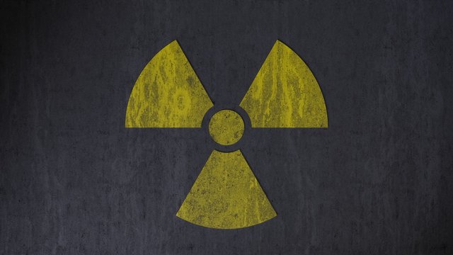 Dirty nuclear warning sign on concrete (3d rendering)