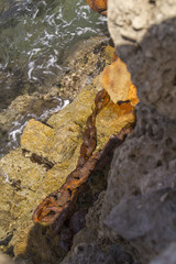 Rustic Chain in Herods Port  ruins in Caesarea. Mediterranean coast of Israel