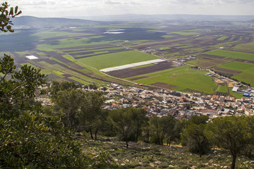 View of the large fertile Jezreel Valley and the Tavor Mountain from the Mount Precipice, Lower Galilee, Israel. 