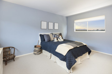 Teenager bedroom interior in blue.