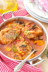 Turkey ossobuco osso buco in tomato gravy with mushrooms