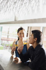 Couple having drinks at bar