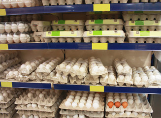 packing fresh eggs in a modern supermarket