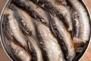 Open can of sprats and other canned smoked fish