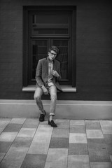 Sitting man looking at the camera