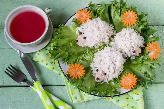 Healthy childrens dinner: meatballs in form of amusing hedgehogs