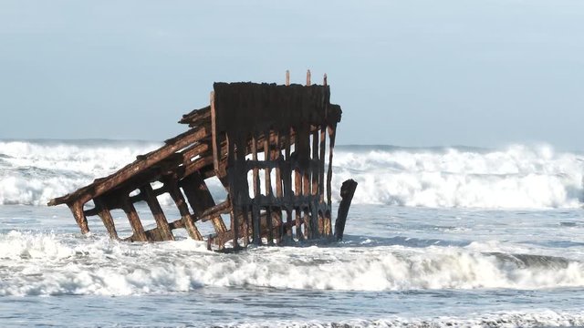 Wreckage of the Peter Iredale gets hit with waves on the Oregon Coast at the Graveyard of the Pacific, Fort Stevens.