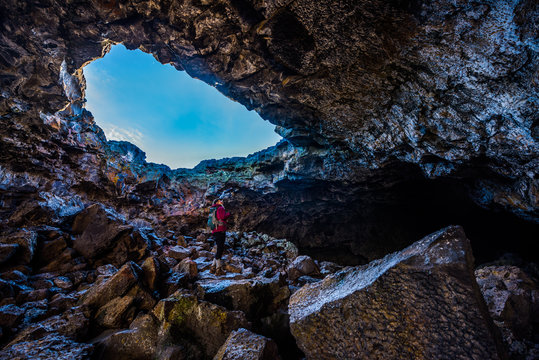Hiker exploring Indian Tunnel Cave