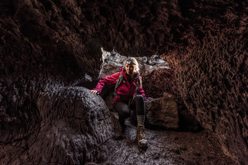 Hiker Girl entering Indian Tunnel Cave