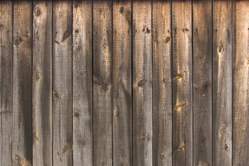 Texture wooden fence with horizontal yellow boards and faded pai