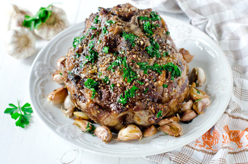 Baked meat with garlic, spices and chimichurri sauce
