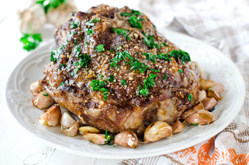 Baked meat with garlic, spices and chimichurri sauce