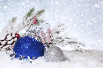 Fototapeta na wymiar Christmas balls in the snow. New Year composition.