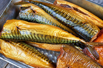 Smoked fish in a tin pan. Smoked mackerel