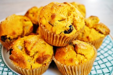 Platter of homemade vegan pumpkin muffins with pears and dried cherries