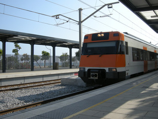 Suburban train along the sea