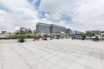 Fototapeta na wymiar modern buildings in shanghai from empty brick floor