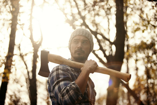 Man with axe in the forest