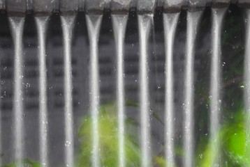 Blur blurred, Motion drop of water rain from roof at night