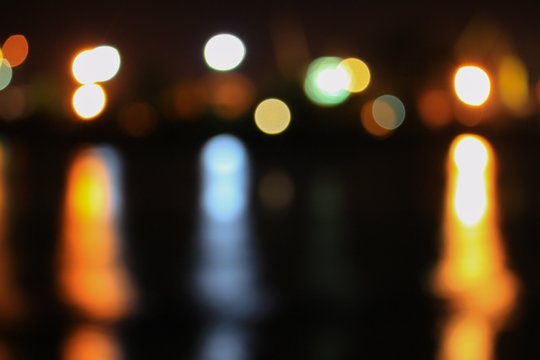 Abstract night light bokeh, Blur blurred River with reflex in water