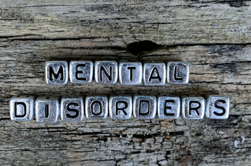 Fototapeta premium cube letter word mental disorders on wooden