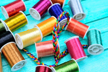color sewing thread on blue table