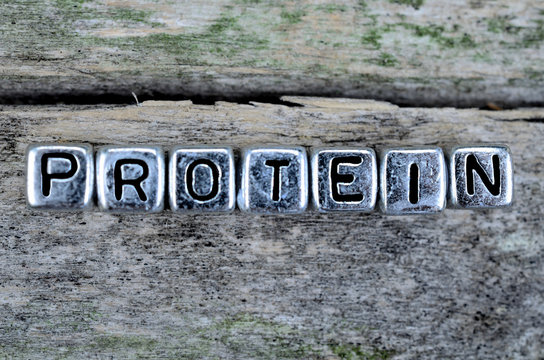 cube word protein on wooden table