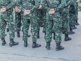 Closeup legs of soldiers in uniforms