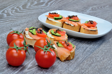 tomato and bruschetta on table