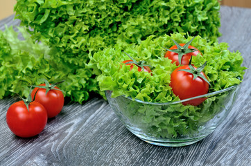 salad and tomato in bowl on table