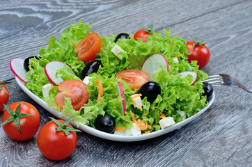 salad and tomato on table