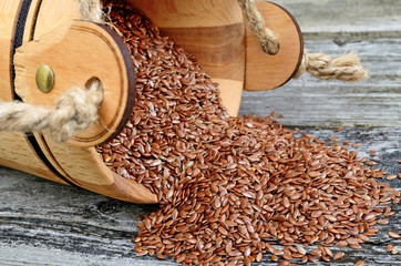 flax seed in bucket flow on table